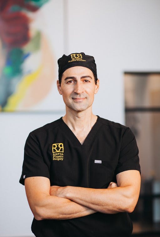 Dr. Repta with arms crossed