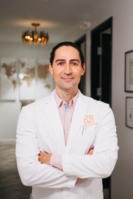 Dr. Repta standing arms with crossed
