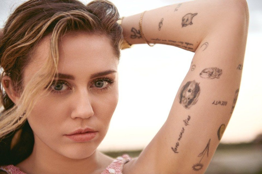 16 Celebrities With Shocking Tattoos Surprising Celebrity Tattoos Miley Cyrus Justin Bie