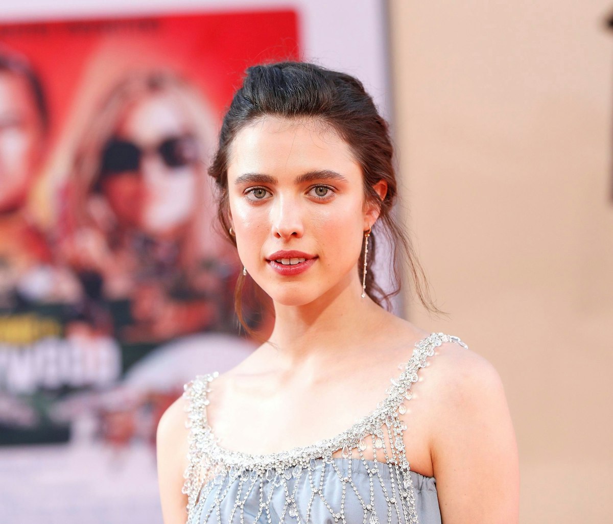 Margaret Qualley covers herself with Chanel handbags as she poses nude on  the beach