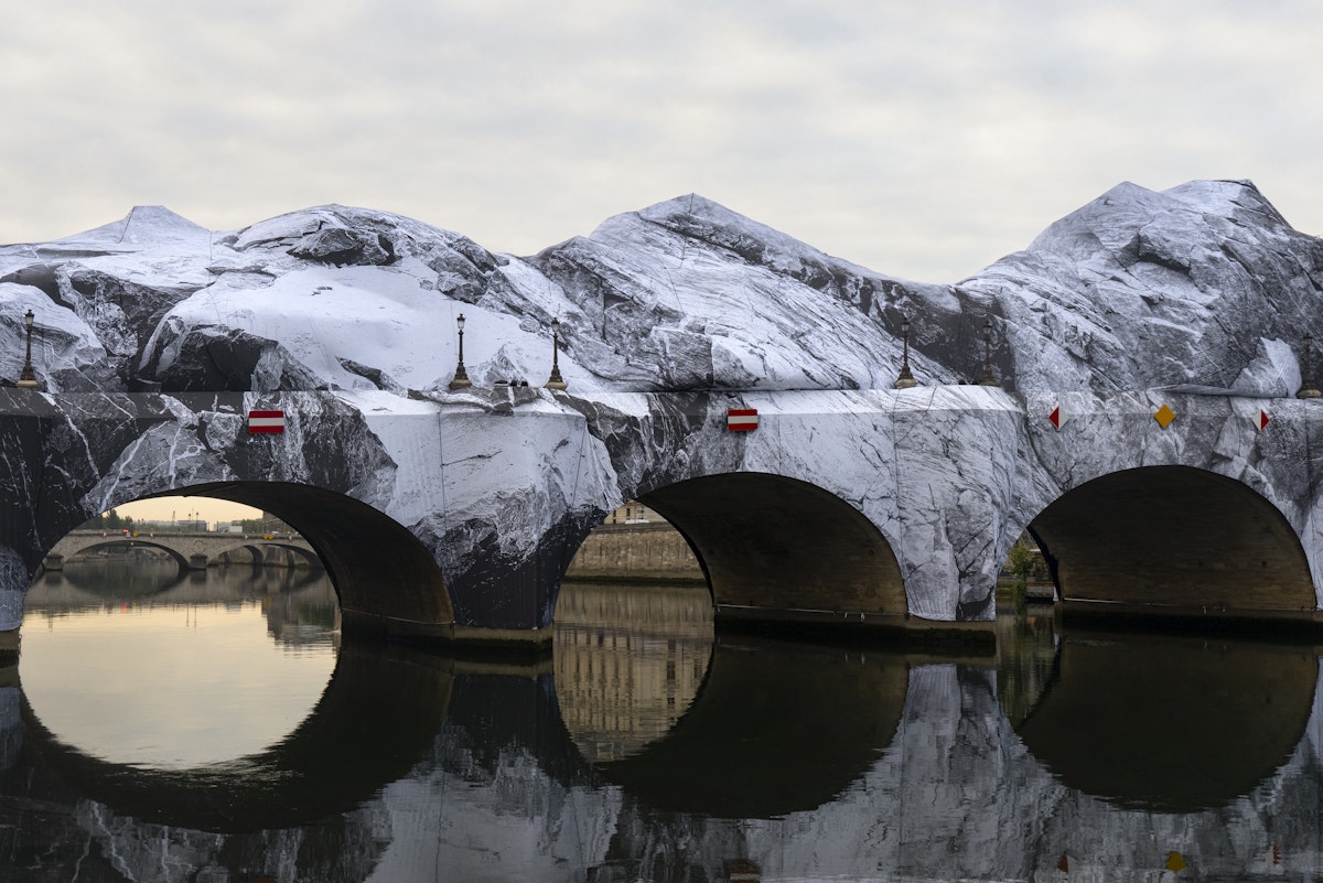 French Artist JR Unveils A Massive Installation Over One of Paris' Most Iconic Landmarks