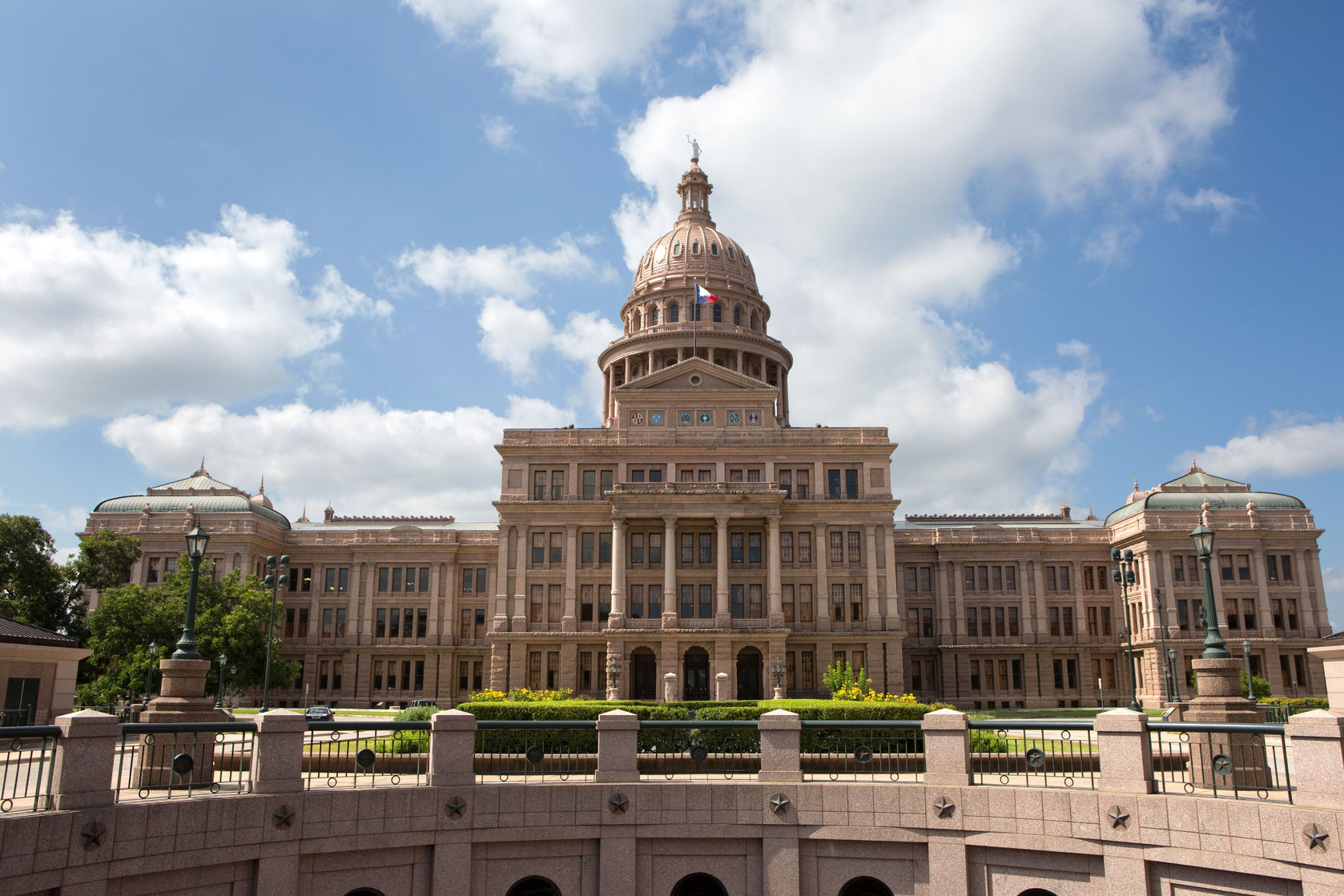 texas state capitol building located in austin, texas, usa.|exterior view of the historic alamo shortly after sunrise|dallas skyline reflected in trinity river at sunset, texas