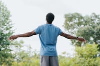 Man wearing a blue shirt standing outside