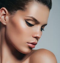 Beautiful woman looking at shoulder