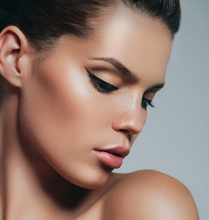 Beautiful woman looking at shoulder