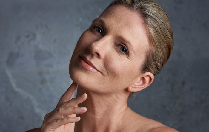 woman touching her jaw area