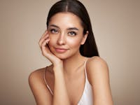 Beautiful Women With Her Hand Holding Her Face