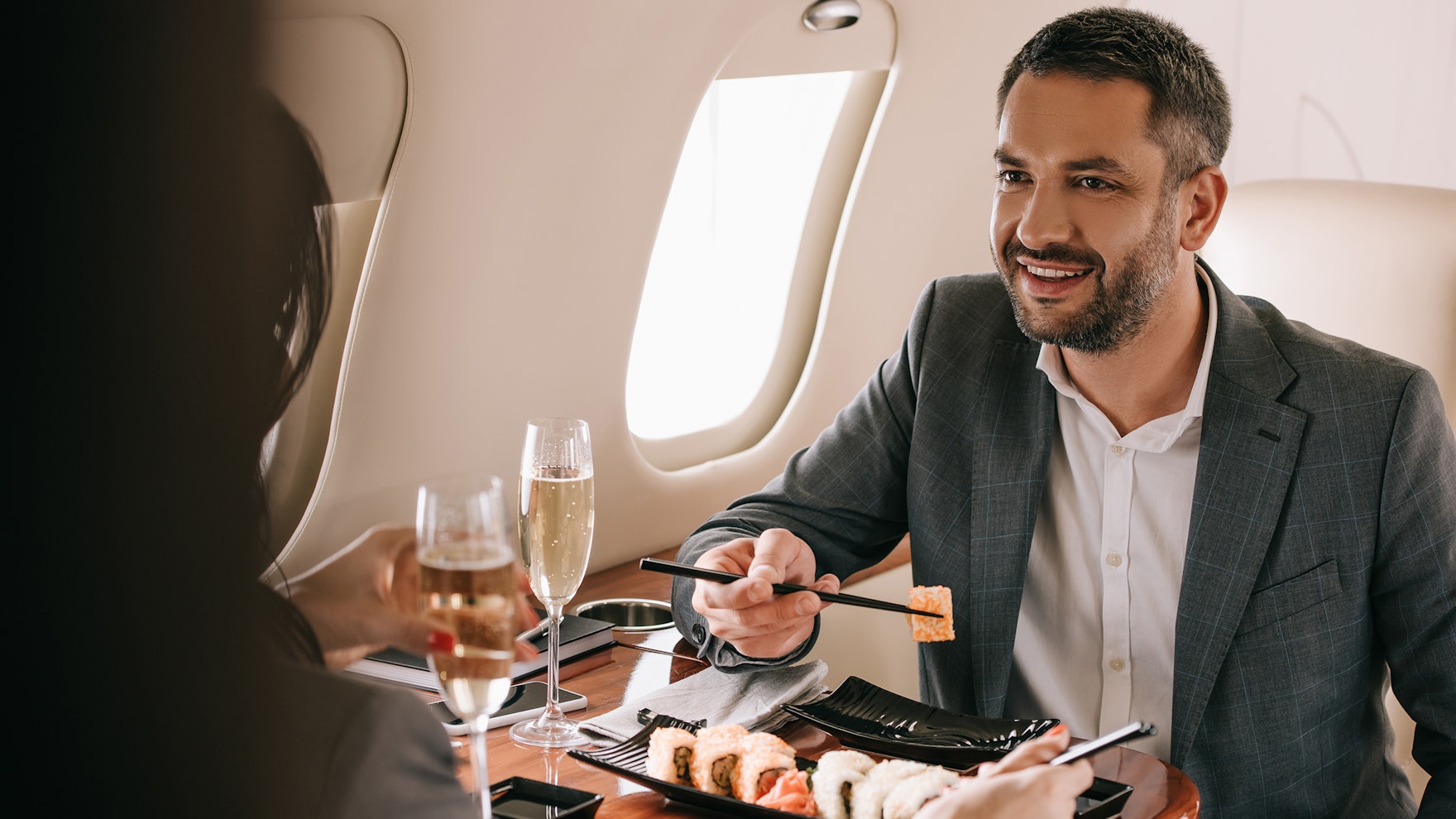 Photo Of Man Eating Sushi On Private Jet