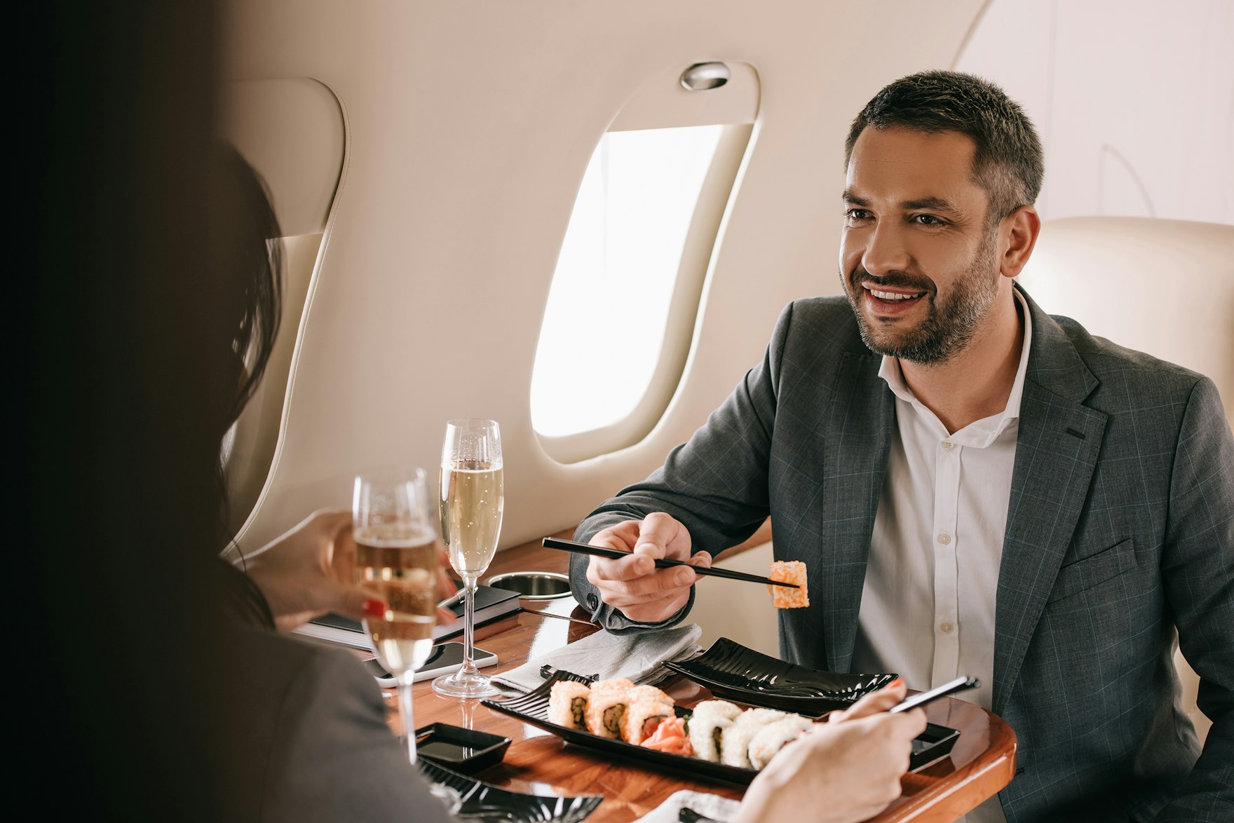 Photo Of Man Eating Sushi On Private Jet