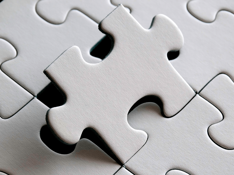 puzzle with one piece lifted