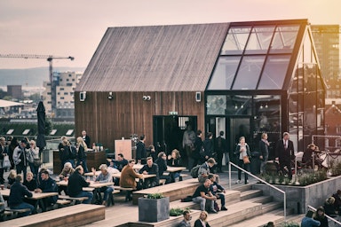 People on the stairs at Salling Rooftop in Aarhus, a big shopping center.