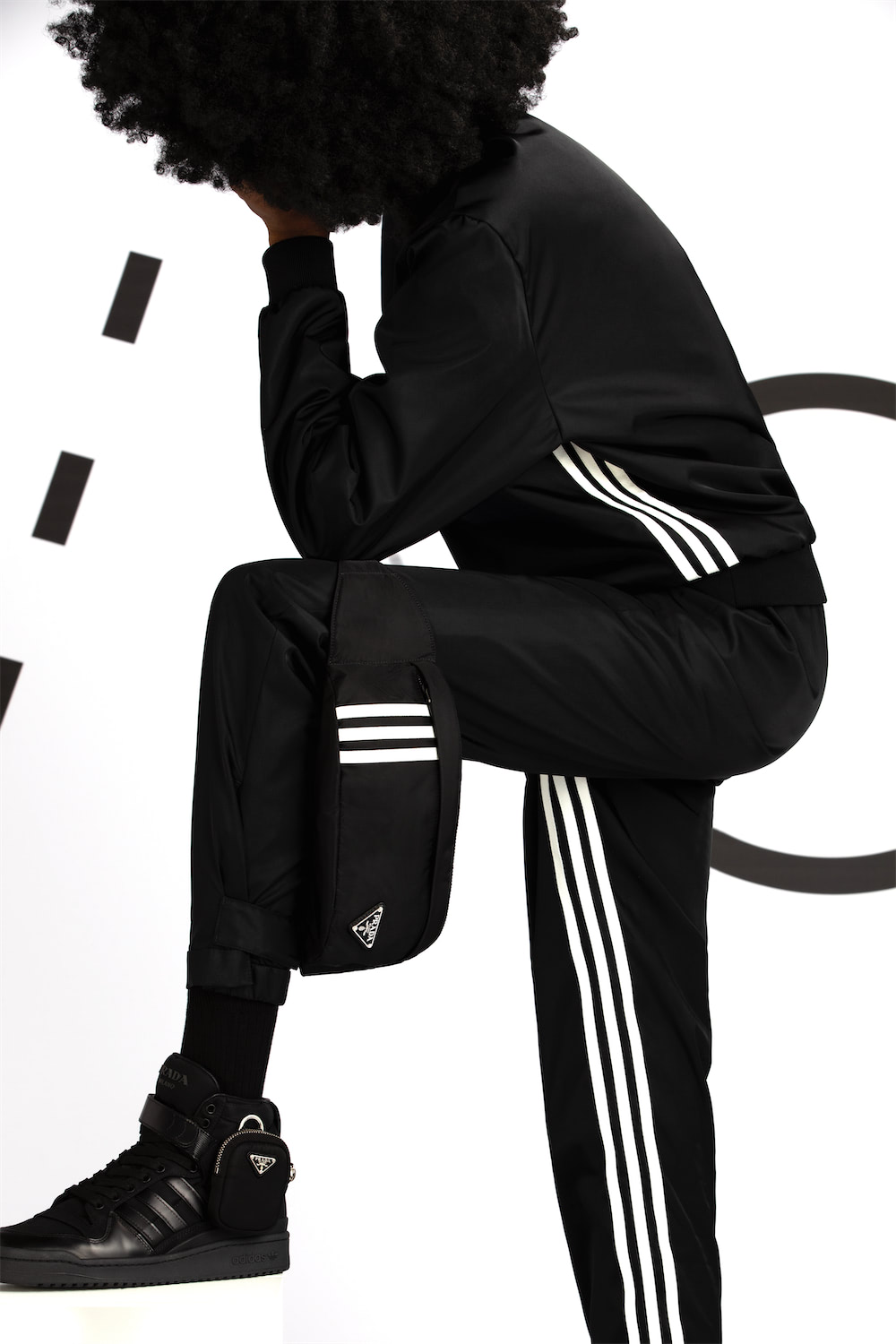 https://www.datocms-assets.com/40484/1641911827-prada_x_adidas_highsnobiety_look_05_152_second_edit_r2.jpg?auto=format
