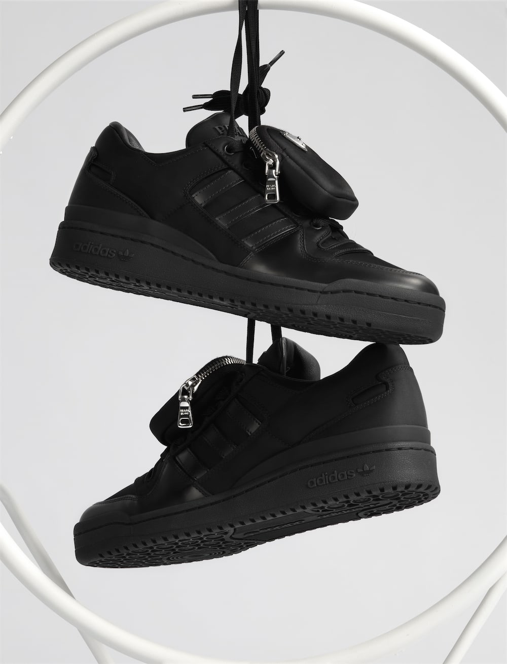https://www.datocms-assets.com/40484/1641911927-prada_x_adidas_highsnobiety_still_life_02_157_second_edit_r2.jpg?auto=format