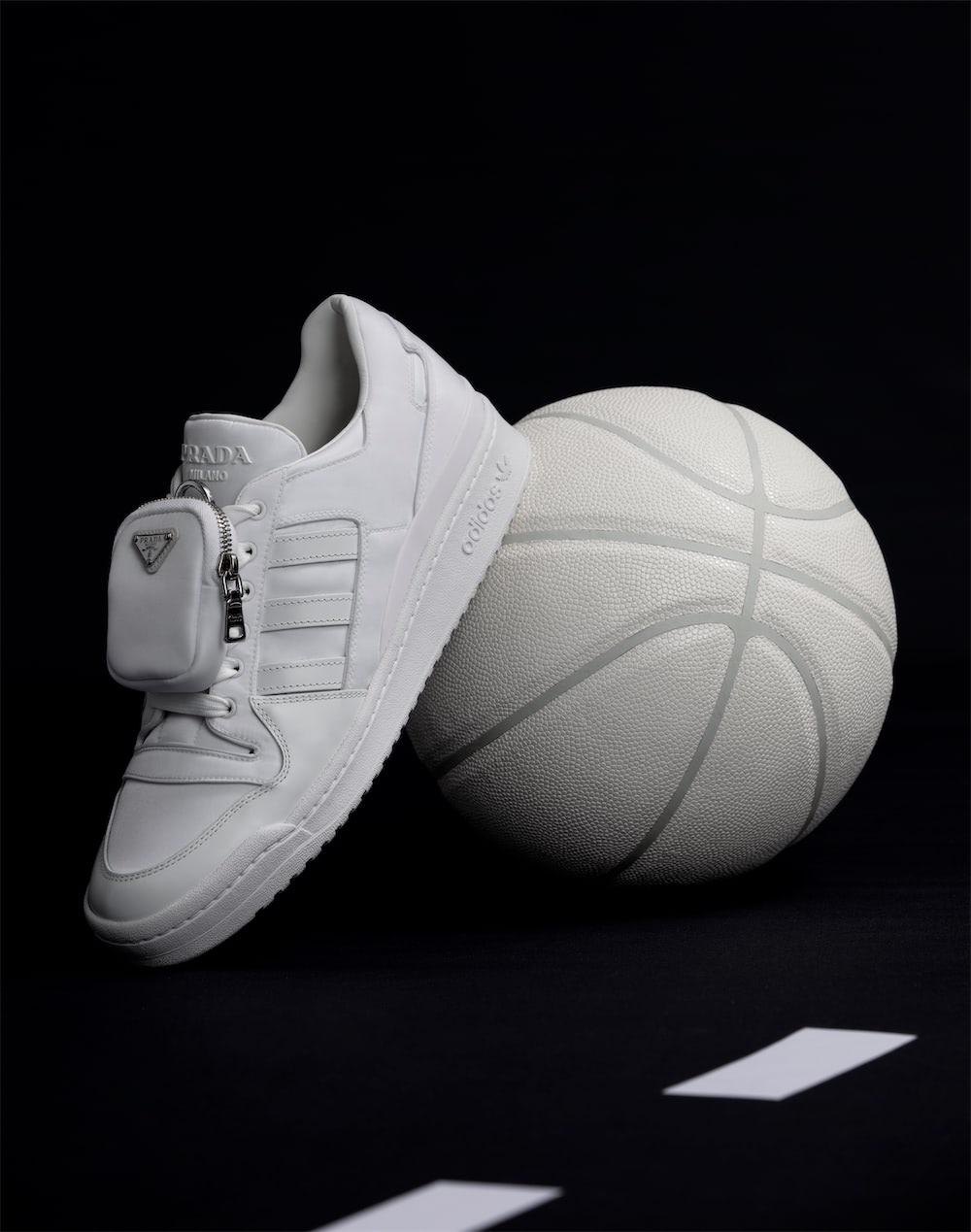https://www.datocms-assets.com/40484/1641911931-prada_x_adidas_highsnobiety_still_life_107_second_edit_r2.jpg?auto=format