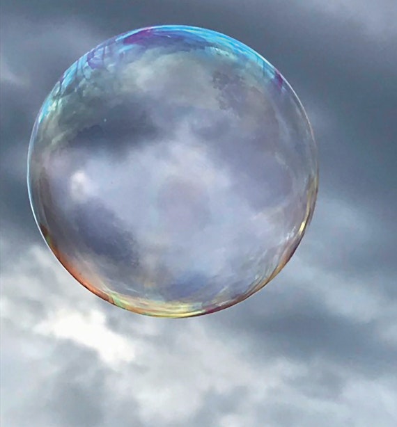 Laura took this photo as part of a series of soap bubbles on a grey afternoon in the local park while playing with her 2 sisters. Photography became a passion of hers during lockdown and homeschooling. 