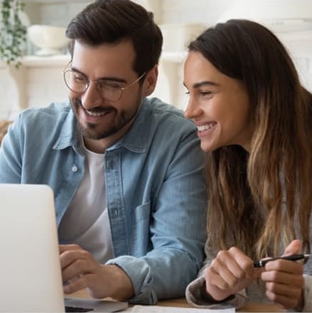 Couple Looking at a Laptop Together