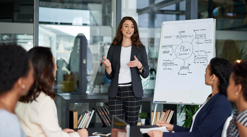 Shot of an attractive young businesswoman giving a presentation in the boardroom