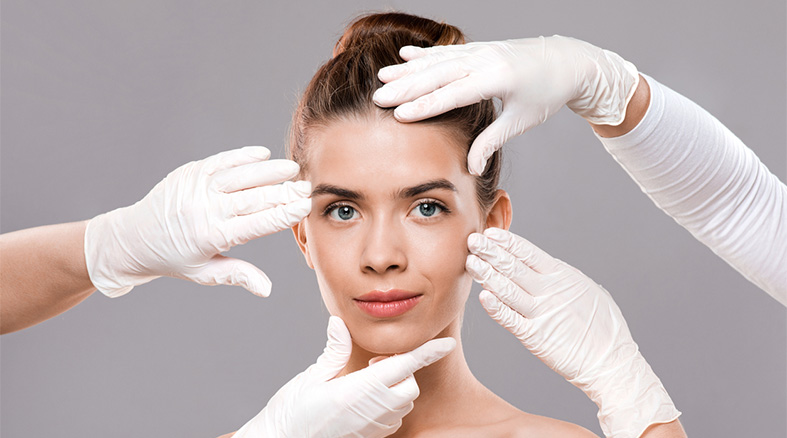 Attractive young woman getting treatment at beauty clinic