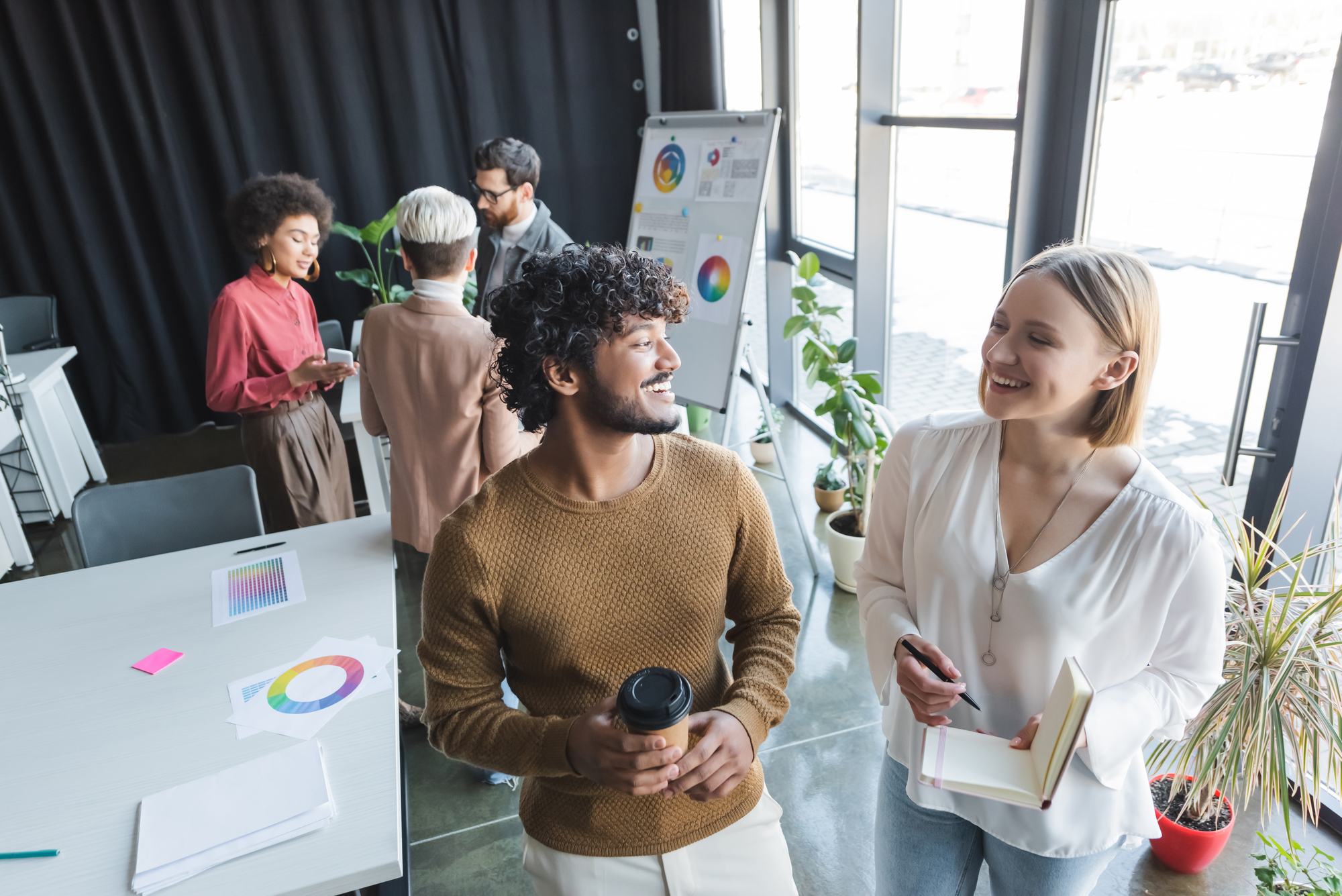 Employees standing in a conference room