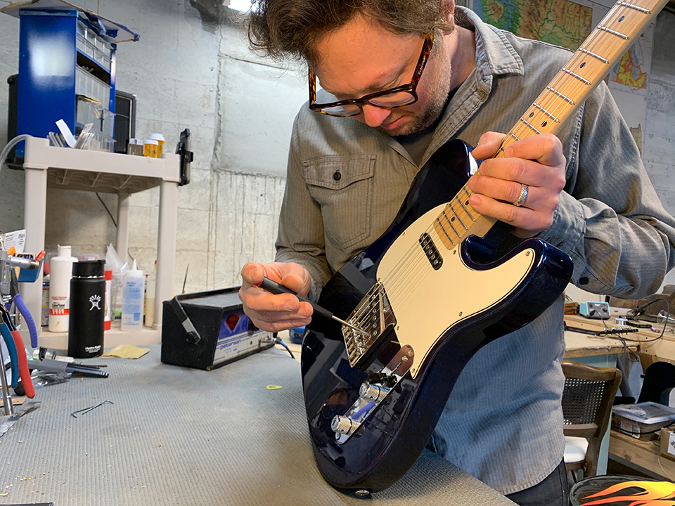 Luthier Jeff Hoppe working on a telecaster style guitar