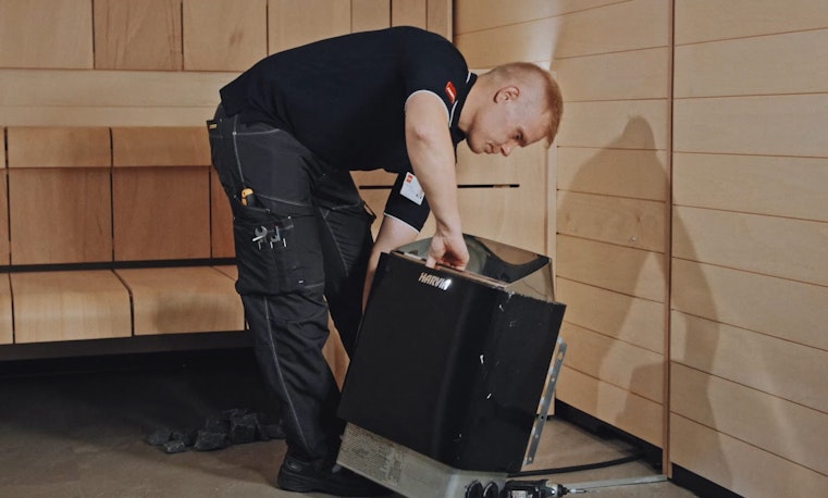 Man installing a electric heater