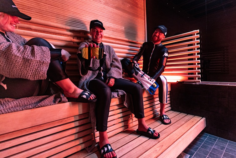 Alpine skiers in sauna