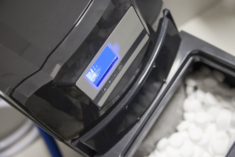 close up picture of water purifying device with chalk tablets inside