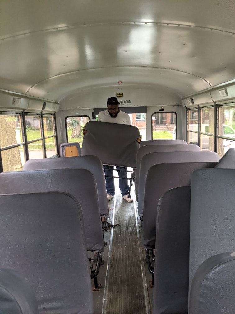 Chris removing the school bus seats
