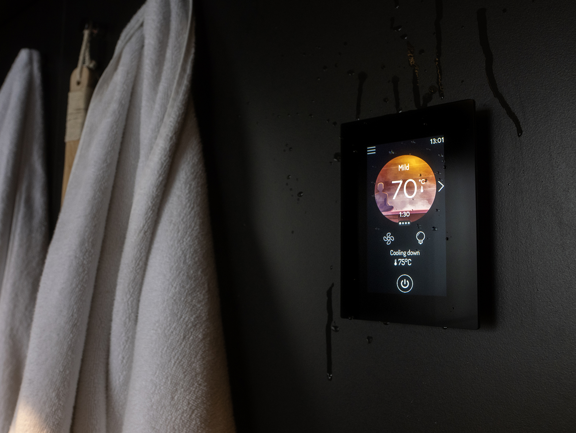 Harvia Fenix FX001XW WiFi touchscreen sauna control panel close-up showing glass display