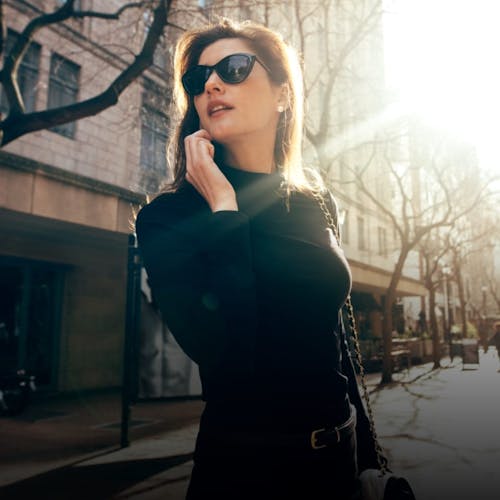woman with dark hair and sunglasses