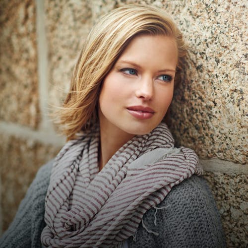 woman with light hair and a scarf