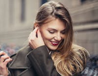 Woman smiling wearing coat