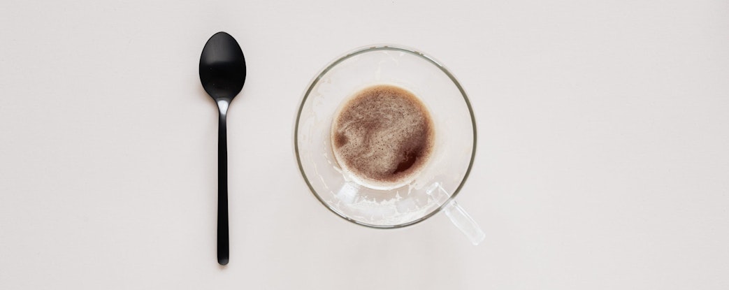 a cup of coffee and a spoon