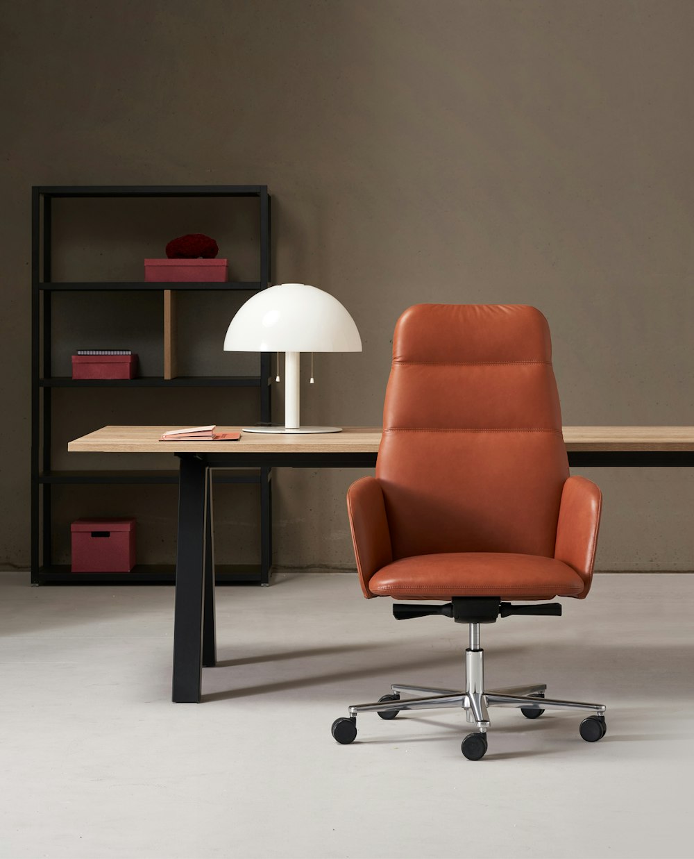 Advanced executive chair in cold-foamed polyurethane Armchair from the Hanami collection in the office with desk and cabinet in the background