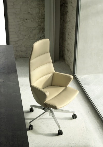 Hyway beige armchair placed near a desk facing the light