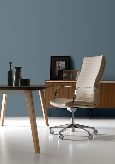 Aurora armchair with padded and practical cushion Arrangement of the Aurora Armchair in a room
