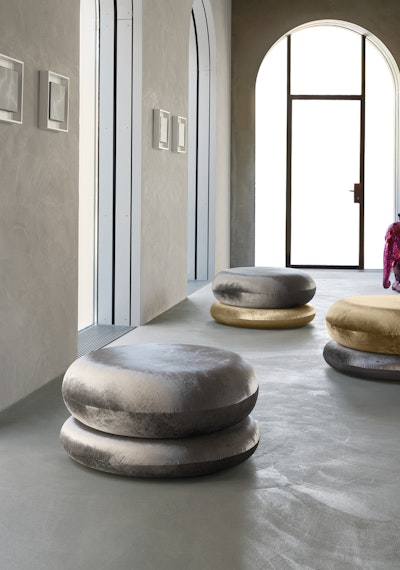 Original and iconic pouf in two separate pieces Placement of poufs of different colors in a bright room