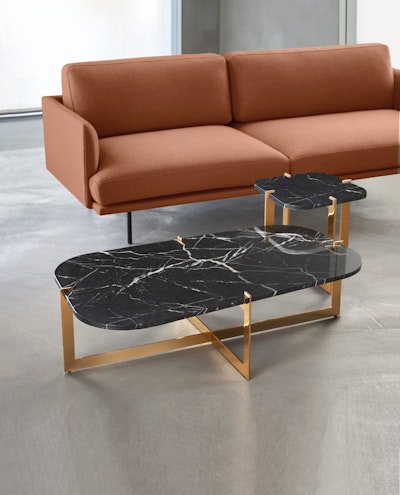 Cruz coffee tables in different sizes placed next to the sofa