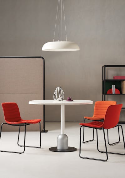 Rudy armchairs in a collection environment around a round table