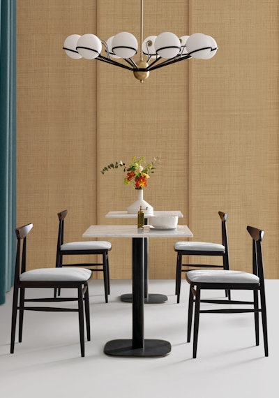 Timeless armchairs arranged around tables in an elegant environment