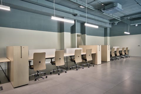 Working area MZ Investment Working area furnished with tables and chairs Quinti