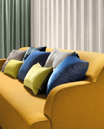 Cushions of various sizes and types on the sofa