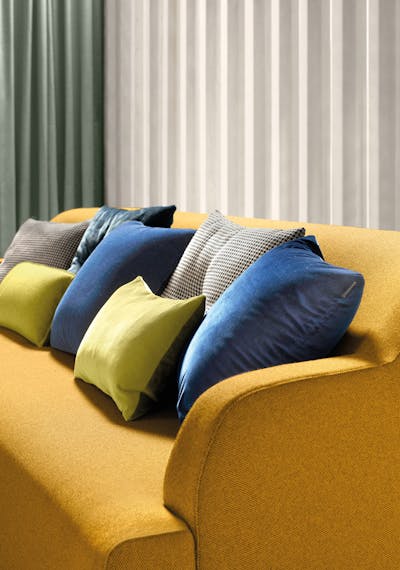 Cushions of various sizes and types on the sofa