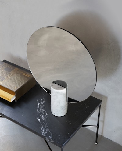 Circular mirror with elegant design support