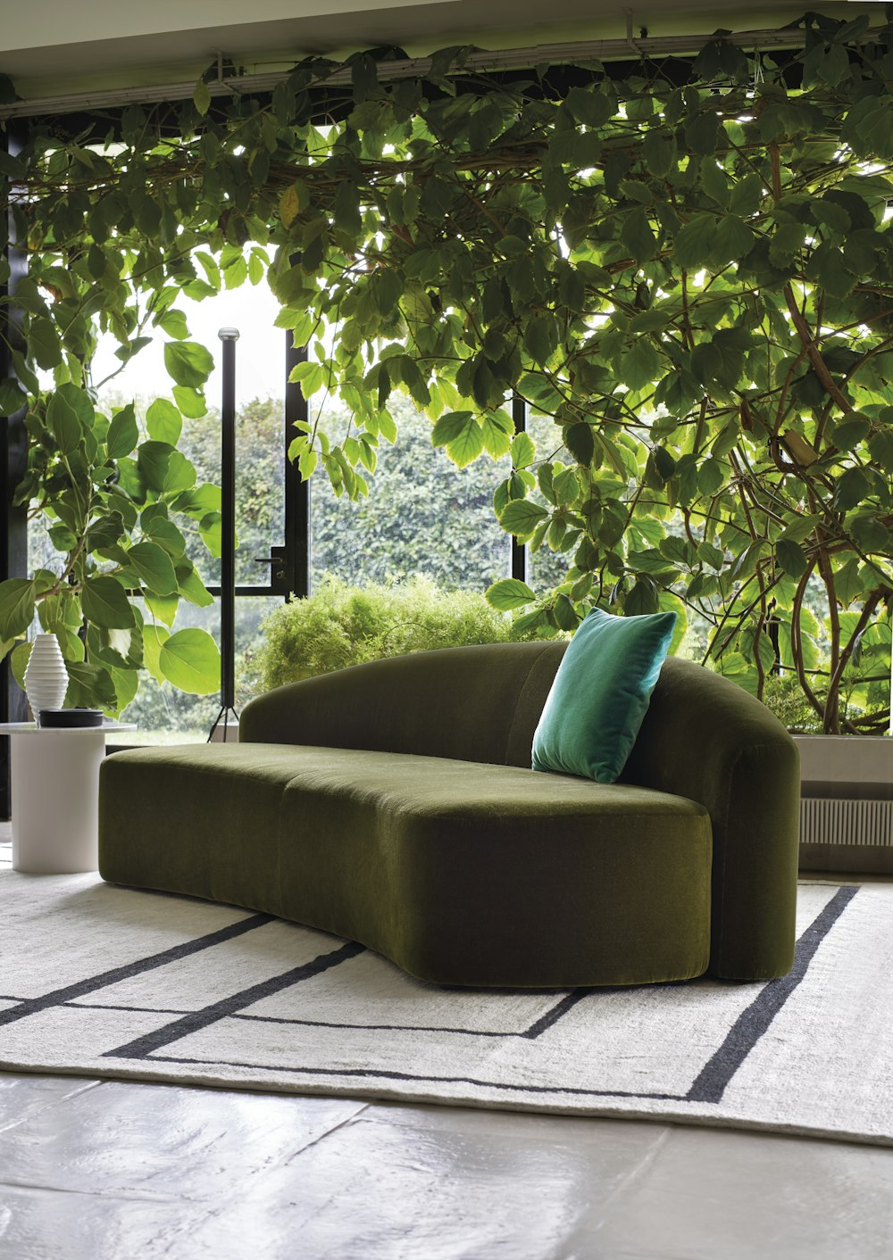 Kyokusen green sofa Kyokusen in living area
