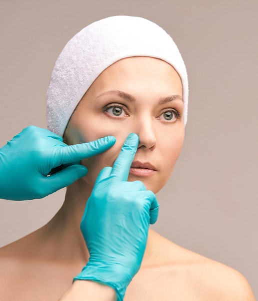 A woman's face being inspected