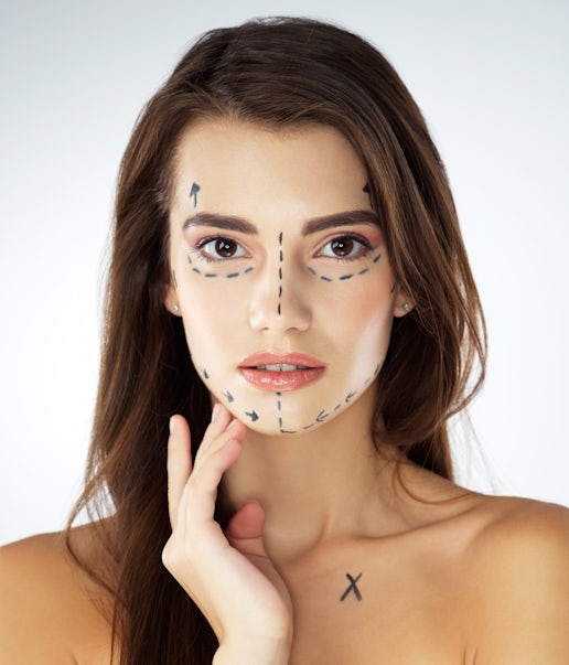 A woman with marker drawings on her face