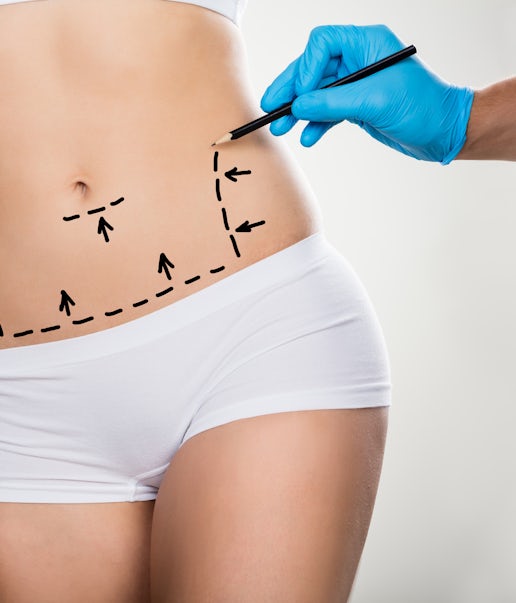 A woman with marker drawings on her tummy
