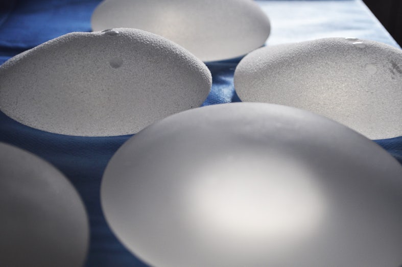Silicone breast implants lined up on a table