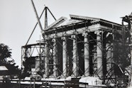 Historical exterior view of the final stone about to be placed in the pediment above the entrance portico of the Gallery from the Art Gallery of New South Wales Institutional Archive 24 March 1902    